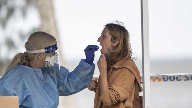 A woman takes a Covid test at the testing facility on the Esplanade. Picture: Brian Cassey