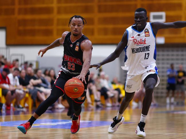 Justin Robinson and Makuach Maluach battle for the ball during the NBL Blitz. Picture: Graham Denholm/Getty Images.