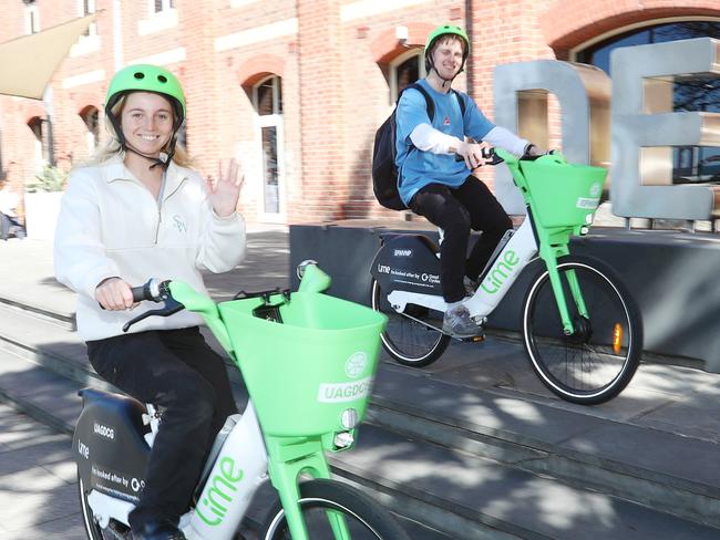 Deakin students Lucy Naylor and Will Rothe try out e-bikes. Students and staff at Deakin UniversityÃs Geelong campuses have access to a new, sustainable means of transport as a 12-month trial of Lime electric bikes (e-bikes) is rolled out across the city. Picture: Alan Barber