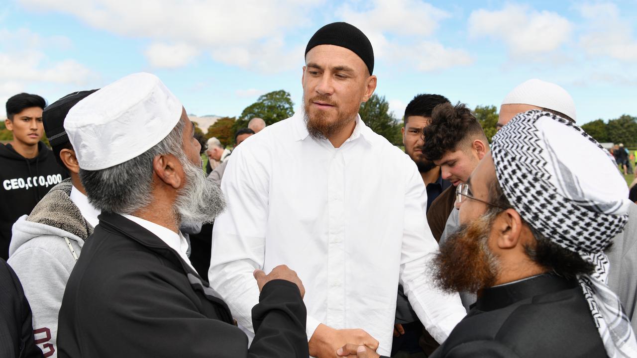 Sonny Bill Williams greets members of the Muslim community near Al Noor mosque.