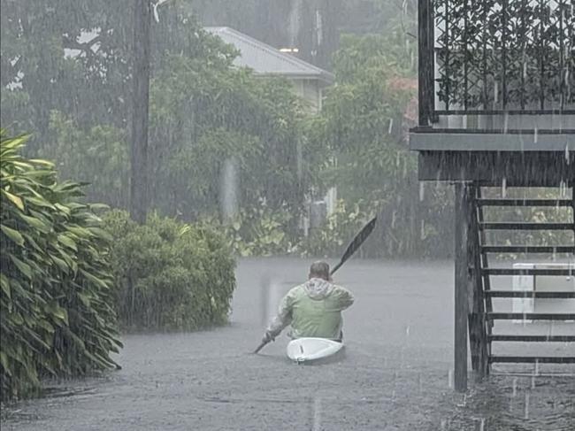 A man canoes Hythe and Long St in Hervey Bay.