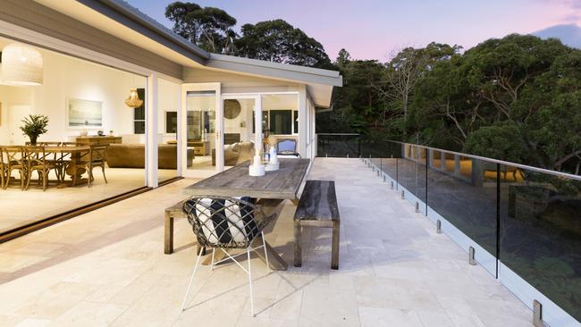 The owners virtually live on the deep terrace of their Seaforth home which has a view of the water, and only one neighbour.