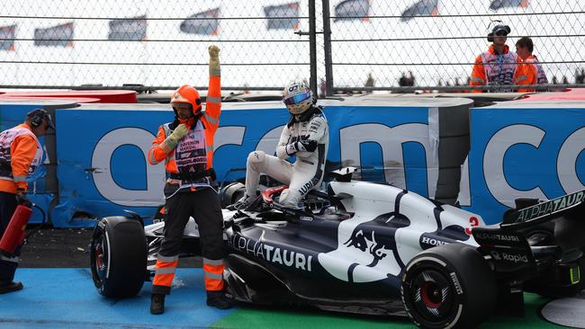 Ricciardo holding his hand after the crash. (Photo by Lars Baron/Getty Images)