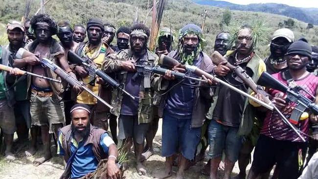 Fighters in Enga Province display their military-style rifles.