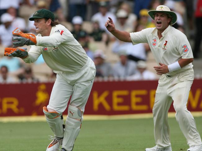 Shane Warne goes up as Adam Gilchrist reaches for a catch in the second Ashes Test at Adelaide Oval in 2006.