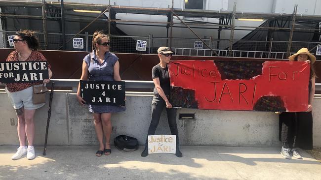 Jari Wise's grandmother Rissah Vox (far right) and supporters of the family outside the Hobart Magistrates Court after Mr Wise's girlfriend Melissa Oates appeared.