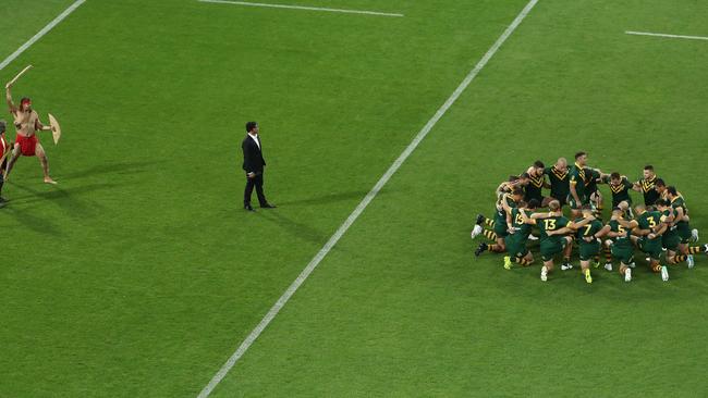 Johnathan Thurston and Australia line up for the pre-game ceremony.