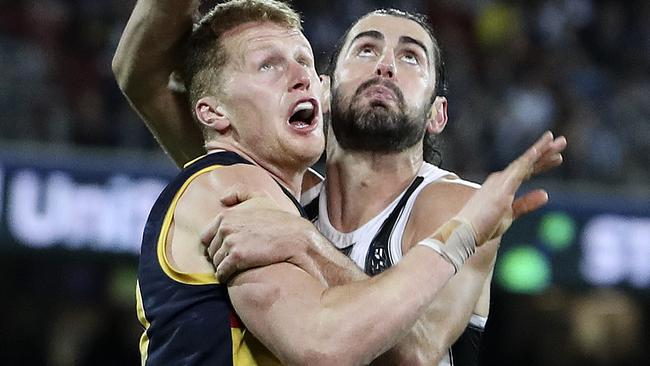 Brodie Grundy contests the ruck against Adelaide’s Reilly O’Brien. Picture: Sarah Reed.