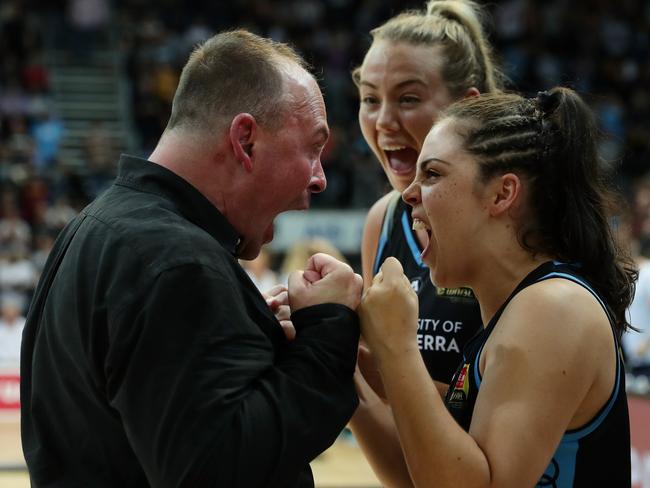 Canberra Capitals coach Paul Goriss and Abby Cubillo celebrate winning game two of the WNBL Grand Final series against Southside Flyers at AIS Arena on March 4, 2020. Picture: Mark Metcalfe/Getty Images