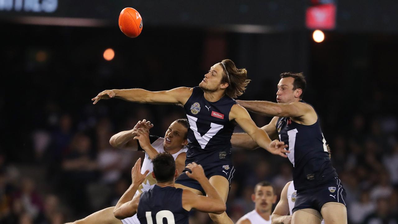 Darcy Moore spoils Nat Fyfe on Friday night. Pic: Michael Klein