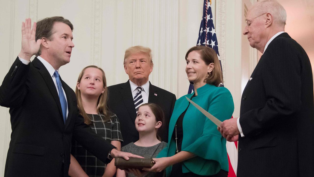 Brett Kavanaugh is sworn-in as Associate Justice of the US Supreme Court by retired Associate Justice Anthony Kennedy before wife Ashley Estes Kavanaugh, daughters Margaret and Elizabeth and US President Donald Trump. Picture: Jim Watson/AFP