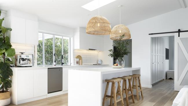 Barn doors and skylights add to the charm.