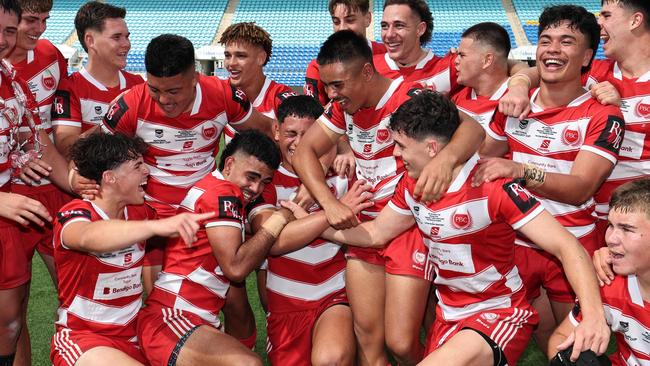 NRL National Schoolboys Cup final at CBUS Stadium  between Palm Beach Currumbin and Patrician Blacktown Brothers. The Red Army and Palm Beach Currumbin players celebrate the win.  .Picture Glenn Hampson