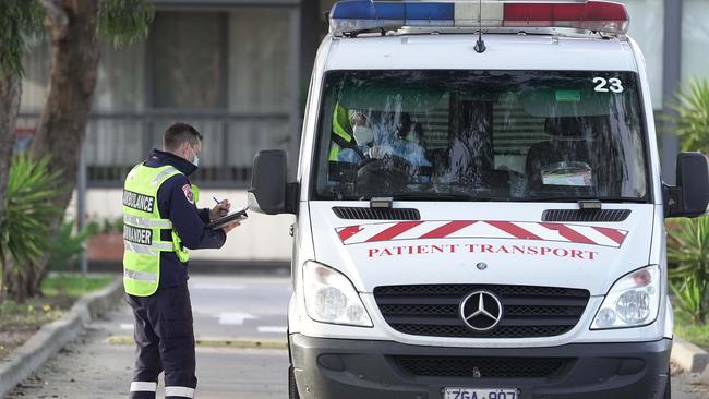 Residents being removed from the home in July. Picture: Stefan Postles