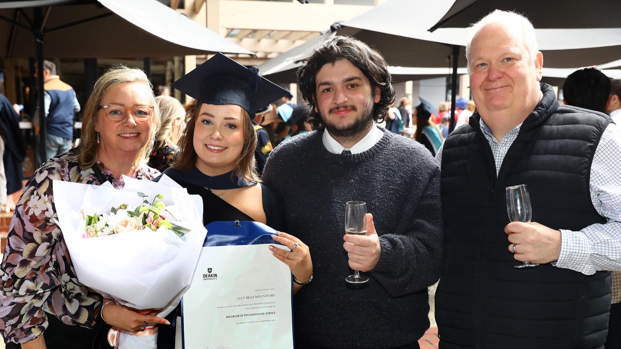 Deakin University graduate Lucy Mountfort with parents Jane and Ken and boyfriend Seb Romero. Picture: Alison Wynd