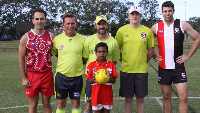 Swans Junior U8 player Jayvontaye Graham (centre) was in charge of the coin toss between Lismore Swans Tim Whalan (left) playing his 101st senior game and Sawtell Toormina Devils during the Sir Doug Nicholls Round on May 29, 2021. Photo: Alison Paterson