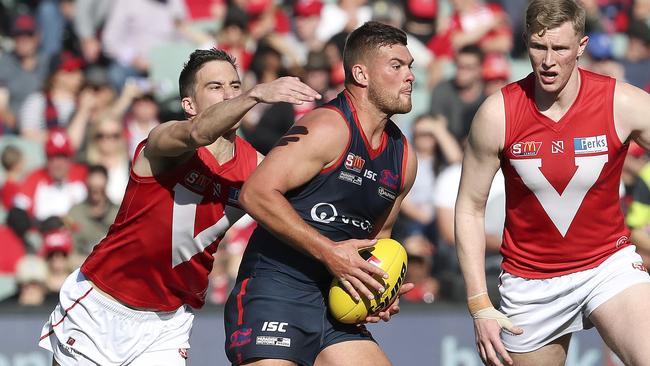 Norwood’s Mitch Grigg breaks free from North’s Tom Schwarz. Picture: Sarah Reed