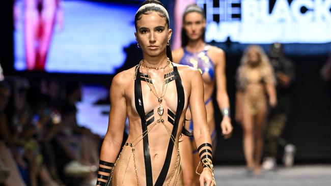 A model walks the runway wearing Black Tape Project during Miami Swim Week. Picture: Arun Nevader/Getty Images for Art Hearts Fashion