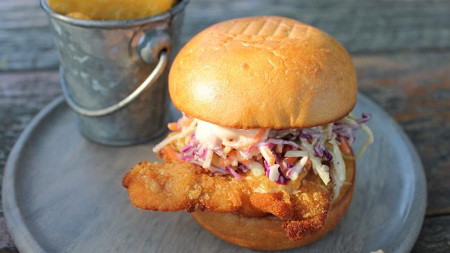 Chicken schnitzel burger and chips.