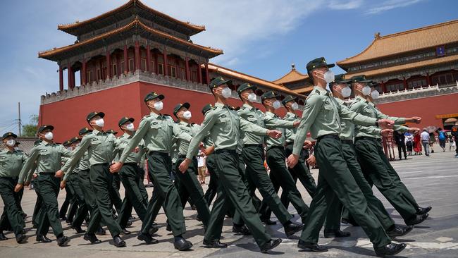 Soldiers of the People's Liberation Army march in front of the entrance of the Forbidden City on May 20. Picture: Getty
