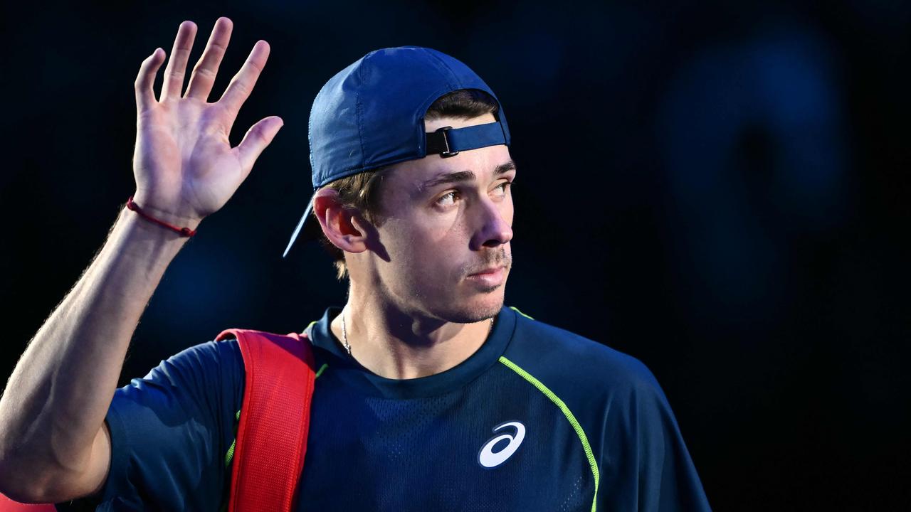 Australia's Alex de Minaur waves after being defeated by Italy's Jannik Sinner during their match at the ATP Finals tennis tournament in Turin on November 10, 2024. (Photo by Marco BERTORELLO / AFP)