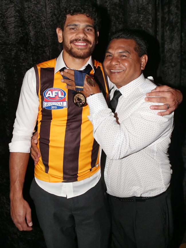 Cyril with his dad Cyril at Crown after the Hawks Grand Final win in 2015. Picture: David Crosling.