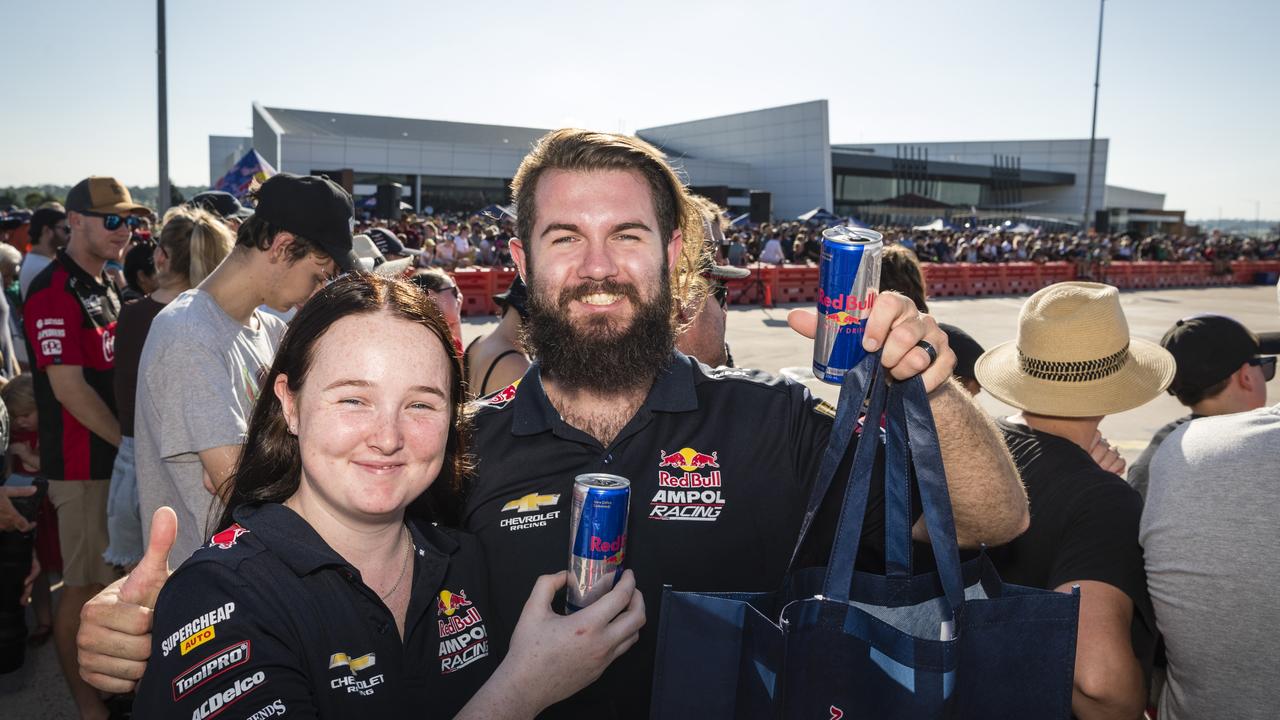 Broc Feeney fans Kaylee Doyle and Brendan Barnes as V8 Supercars team Red Bull Ampol Racing launch their 2024 livery at Toowoomba Wellcamp Airport, Saturday, February 3, 2024. Picture: Kevin Farmer