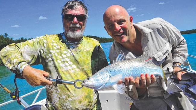 Now what are these two blokes up to? Bill Sawynok from Infofish on the left is fishing with Crownbet’s Brad Fanning, and is about to release a very-important silver barra.