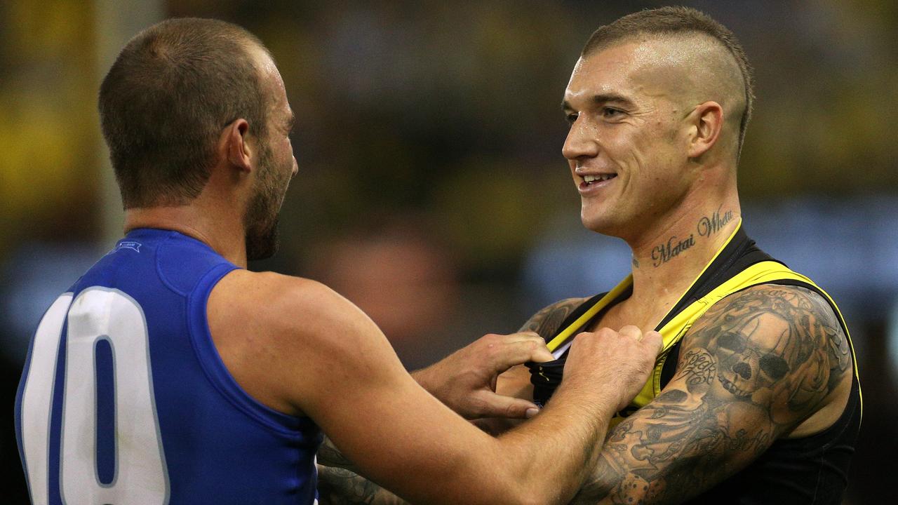 Kangaroo Ben Cunnington has a disagreement with Dustin Martin.