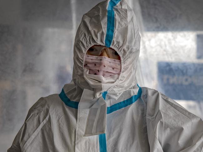 MANILA, PHILIPPINES - MAY 22: A Chinese traveler wearing a protective suit passes through a decontamination tent upon arriving at Ninoy Aquino International Airport after a limited number of flights have resumed following relaxed lockdown measures on May 22, 2020 in Manila, Philippines. The Philippine government began easing quarantine measures in many areas of the country, but has extended the lockdowns in Manila and a few other cities until May 31. Manila's lockdown, one of the worlds strictest, will extend to 80 days longer than the 76-day lockdown of Wuhan, the Chinese city that was the early epicenter of COVID-19. The Philippines' Department of Health has so far reported 13,597 cases of the coronavirus in the country, with at least 857 recorded fatalities. (Photo by Ezra Acayan/Getty Images)