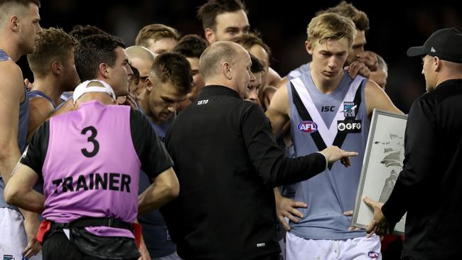 Ken Hinkley of the Power speaks with players during the Round 20 AFL match between the Essendon Bombers and the Port Adelaide Power at Marvel Stadium in Melbourne, Saturday, August 3, 2019. (AAP Image/Mark Dadswell) NO ARCHIVING, EDITORIAL USE ONLY