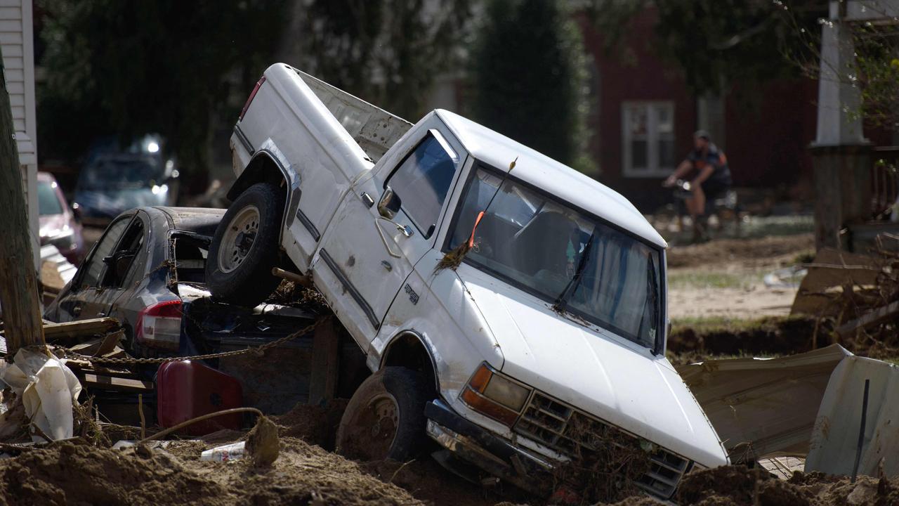 OLD FORT, NORTH CAROLINA - SEPTEMBER 29: Two vehicles lie upended from flooding in the aftermath of Hurricane Helene on September 29, 2024 in Old Fort, North Carolina. According to reports, more than 60 people have been killed across the South due to the storm, and millions have been left without power. North Carolina has been approved for a Federal Major Disaster Declaration. Melissa Sue Gerrits/Getty Images/AFP (Photo by Melissa Sue Gerrits / GETTY IMAGES NORTH AMERICA / Getty Images via AFP)