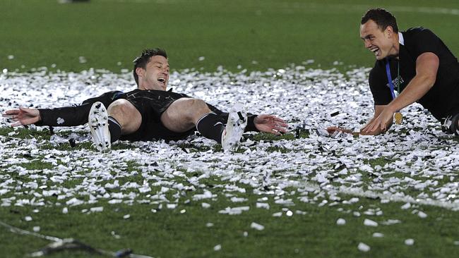 All Blacks Cory Jane and Israel Dagg make snow angels in confetti after the 2011 World Cup final.