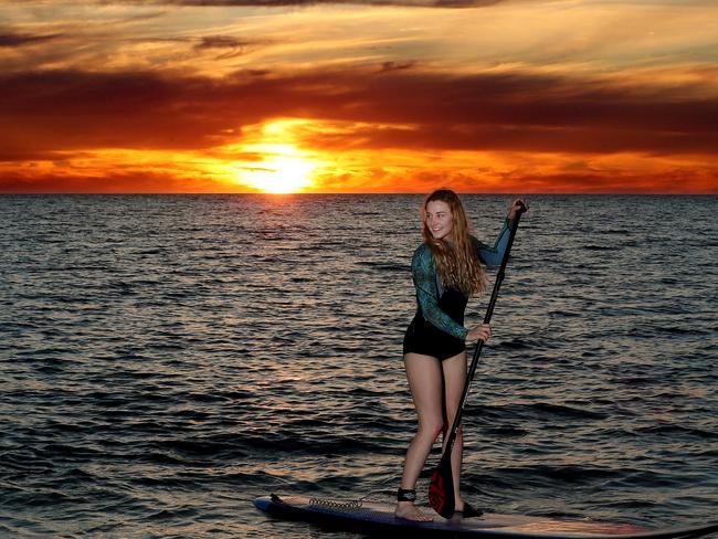 Beach pictures. Brooke Shea of Rosewater on a stand up paddle boards at Seacliff beach. Picture: Dylan Coker