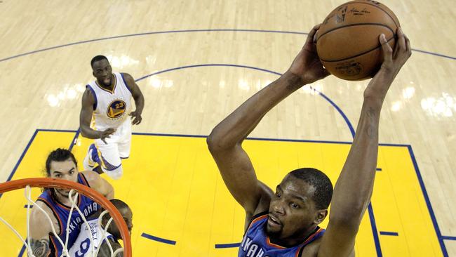 Kevin Durant of the Oklahoma City Thunder dunks the ball against the Golden State Warriors.