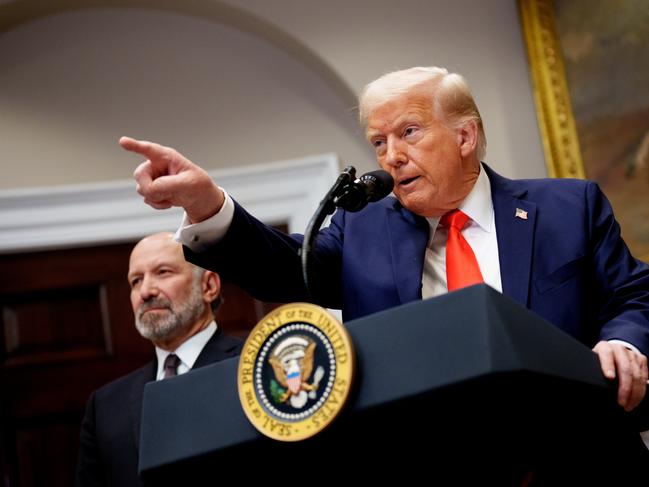 WASHINGTON, DC - MARCH 03: U.S. President Donald Trump, accompanied by Commerce Secretary Howard Lutnick (L) takes a question from a reporter in the Roosevelt Room of the White House on March 3, 2025 in Washington, DC. Trump announced that Taiwan Semiconductor Manufacturing Company, one of the largest manufacturers of semiconductor chips, plans to invest $100 billion in new manufacturing facilities in the United States. (Photo by Andrew Harnik/Getty Images)