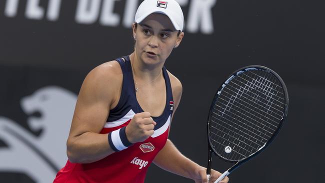 Ash Barty celebrates a win over Elise Mertens.