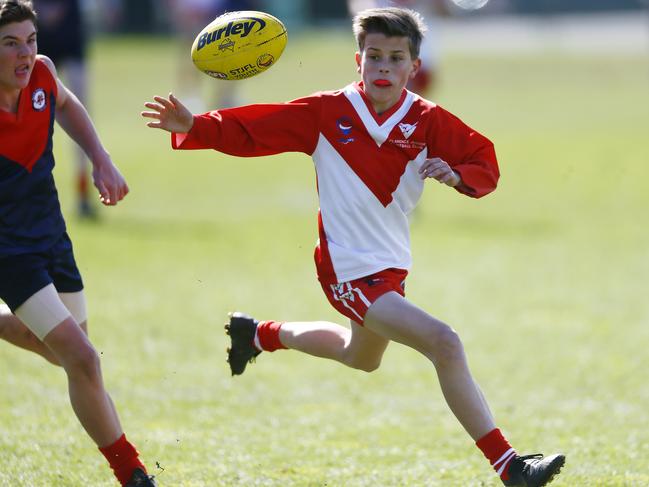 Junior Football - Cripps STJFL 2019 Grand Finals held at North Hobart Oval. Under14 Boys Clarence Vs North Hobart Demons. (L-R) Charlie Banks getting control of the ball. Picture: MATT THOMPSON