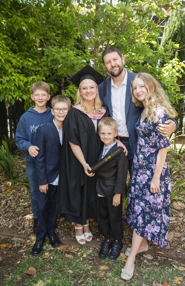 Master of Education (Distinction) graduate Lisa Evans with family (from left) Hyrum, Thomas, Ben, Brendon and Emily Evans at a UniSQ graduation ceremony at Empire Theatres, Tuesday, October 31, 2023. Picture: Kevin Farmer