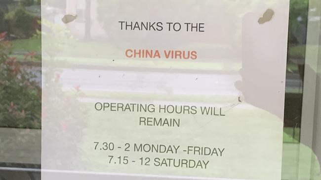 A Gold Coast barber has defended a sign blaming the ‘China virus’ for reduced operating hours.