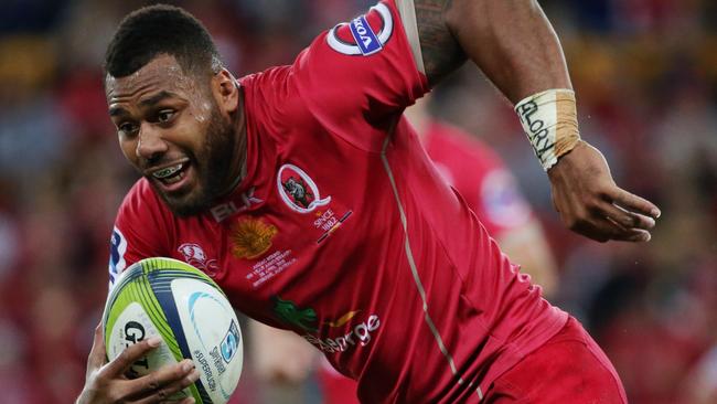 Reds centre Samu Kerevi on the charge against the Hurricanes.