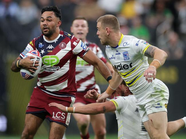 LAS VEGAS, NEVADA - MARCH 01: Bevan French of the Wigan Warriors runs with the ball against the Warrington Wolves during the Super League match between the Wigan Warriors and the Warrington Wolves at Allegiant Stadium, on March 01, 2025, in Las Vegas, Nevada.   Ezra Shaw/Getty Images/AFP (Photo by EZRA SHAW / GETTY IMAGES NORTH AMERICA / Getty Images via AFP)