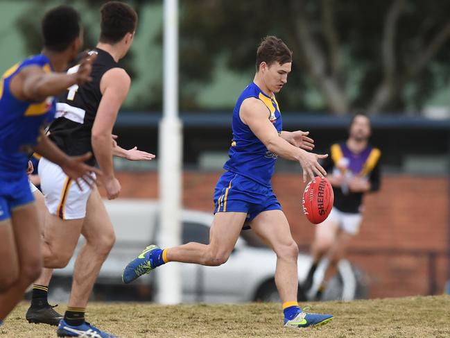 Noble Park champion Kyle Martin takes a kick. Picture: Chris Eastman