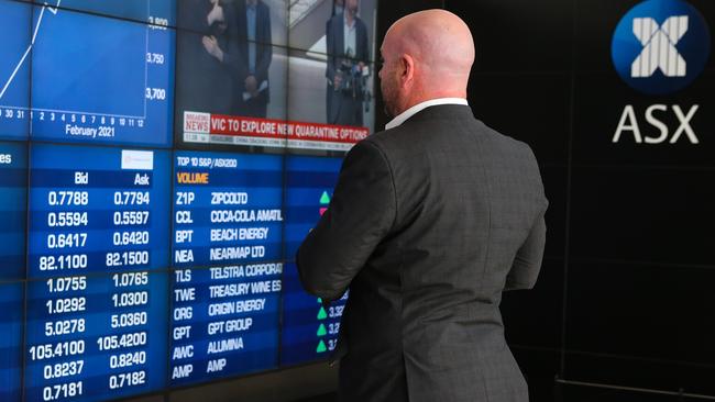 SYDNEY, AUSTRALIA - NewsWire Photos FEBRUARY 16, 2021, A businessman is seen reviewing the Stock prices at the  the ASX today in the CBD, Sydney, Australia. Picture: NCA NewsWire / Gaye Gerard