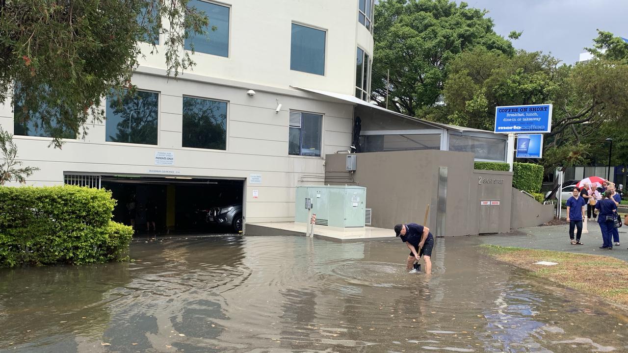 Rain floods the entryway to a car park in Southport. Picture: Emily Halloran