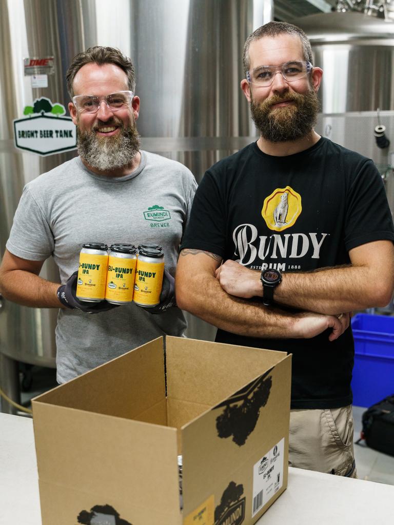 Eumundi Brewers Chris Sheehan and Allan Tilden at work in the Eumundi Brewery canning the new brew, Eu-Bundy IPA. Picture: Alain Bouvier