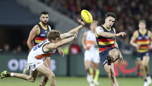 Adam Kennedy tries to smother Lachlan Murphy's kick. Picture SARAH REED