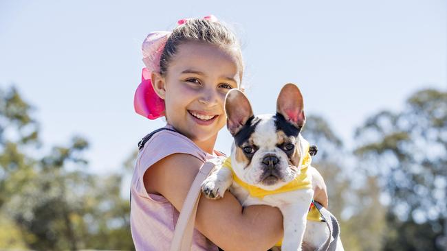 Sienna de Waal, 9, with Frankie at Paws at the Park held at Mudgeeraba showground on Sunday. Picture: Jerad Williams