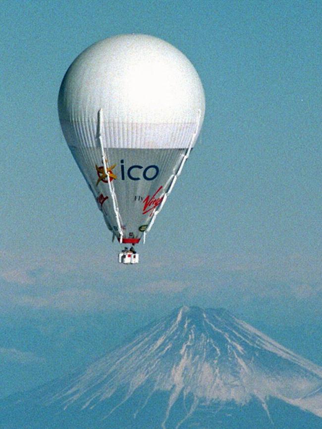 Virgin Global Challenge hot-air balloon crewed by Richard Branson, Steve Fossett and Per Lindstrand passes Japan's Mount Fuji on Christmas Eve 1998 during their non-stop bid to circumnavigate world.