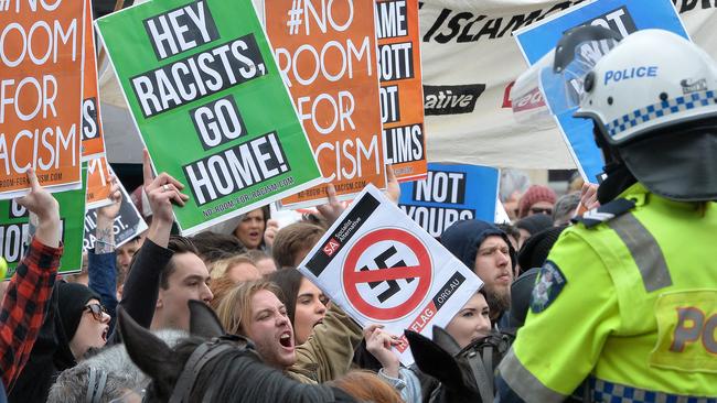 Protesters in front of moutned police. Picture: Rob Leeson.